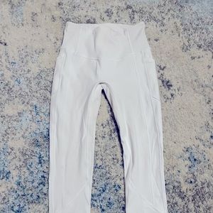 White Lululemon leggings. W/side pockets and lined.